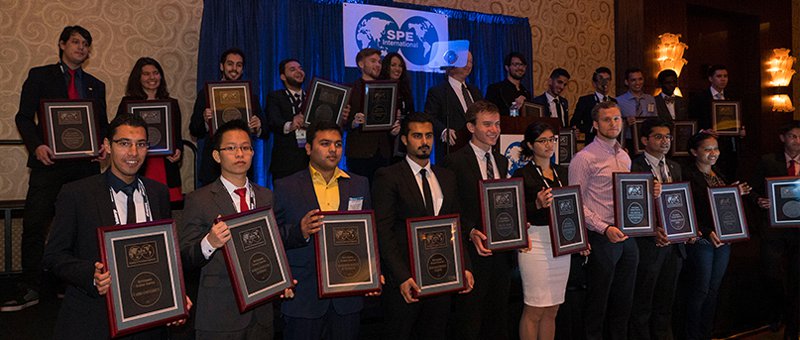 Group of members holding awards